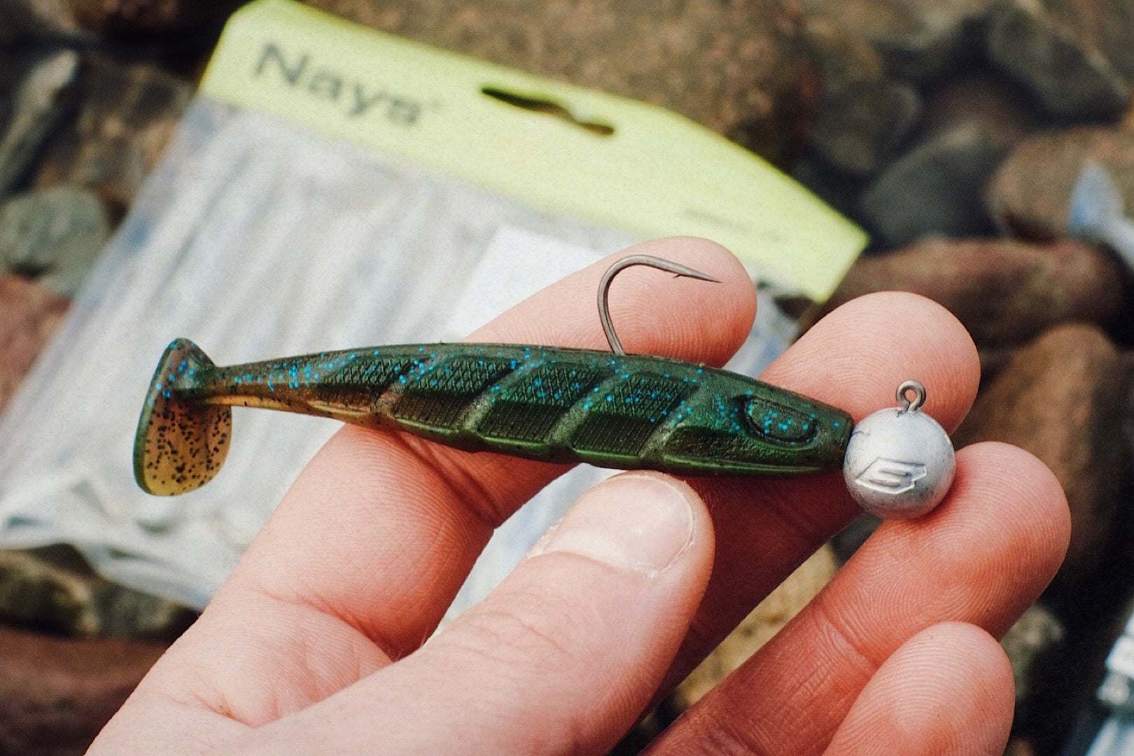 Nays PRDTR 50 2.0 softbait rigged on a jighead – green color held by hand, ready for fishing