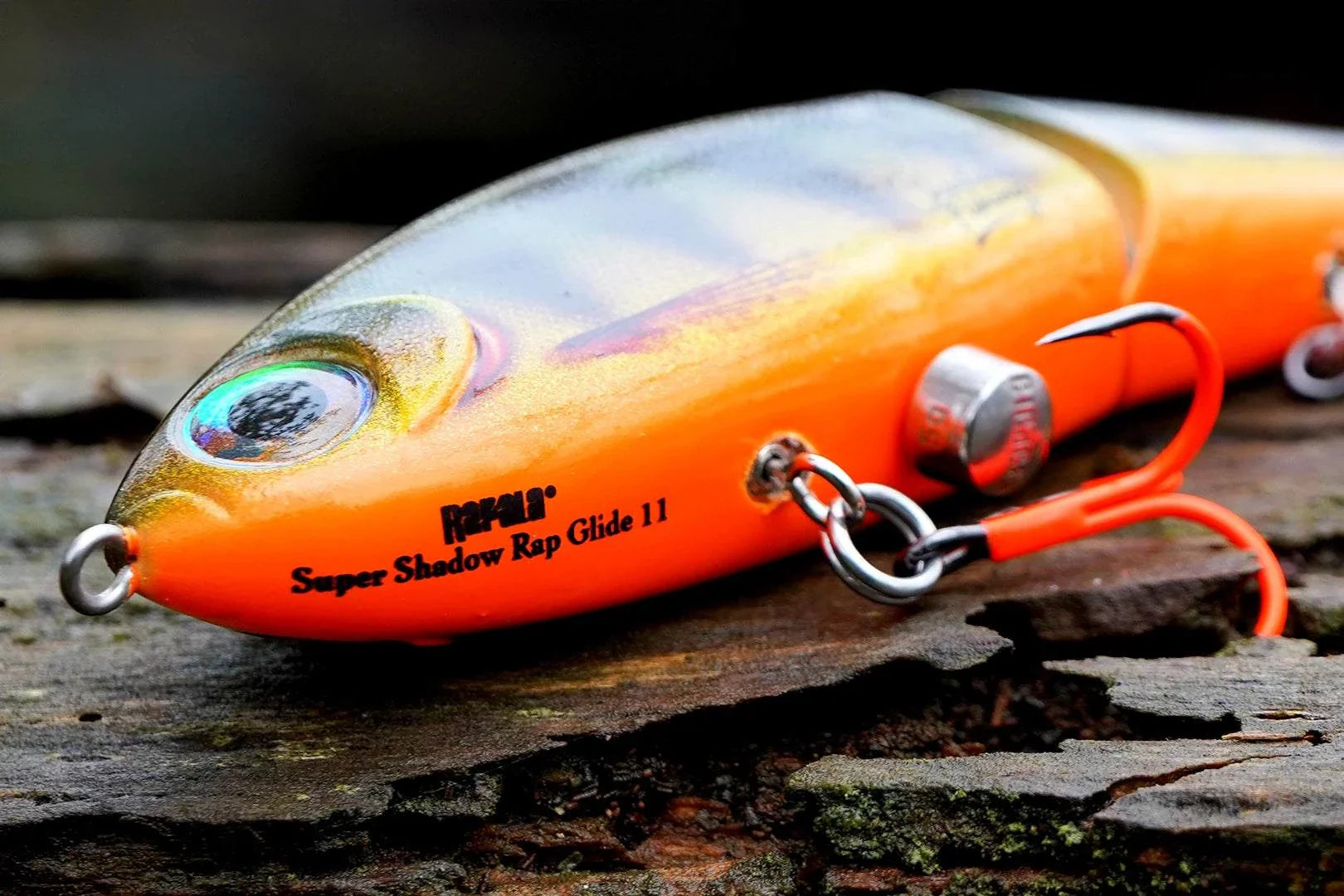 Rapala x Charlie's Limited Edition Super Shadow Rap Glide 11 lure with perch pattern, golden accents, VMC UV orange hooks, and interchangeable tails for all water conditions