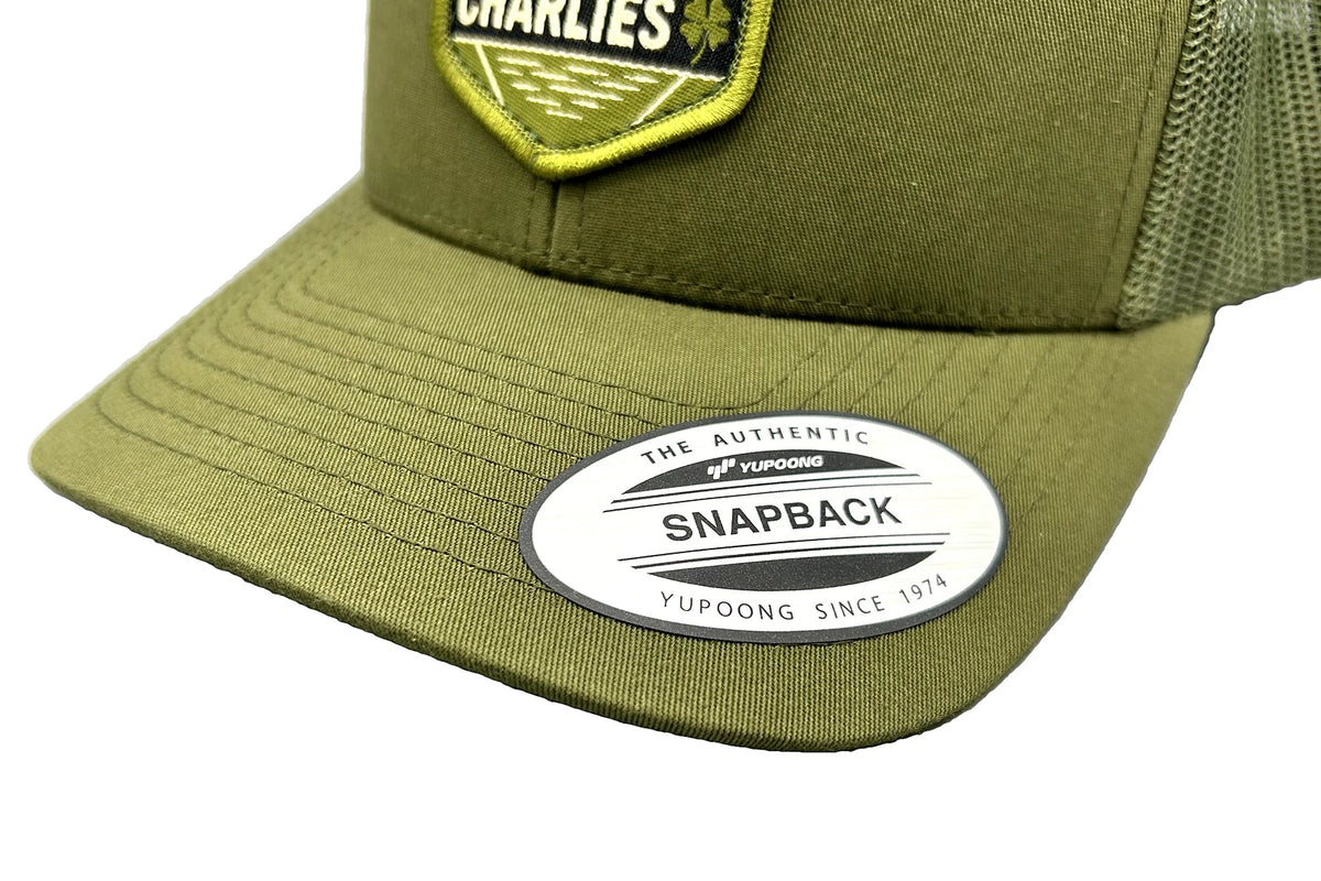 Charlie's Fishing Cap Green Bass, close-up of the curved visor of the olive green snapback fishing cap