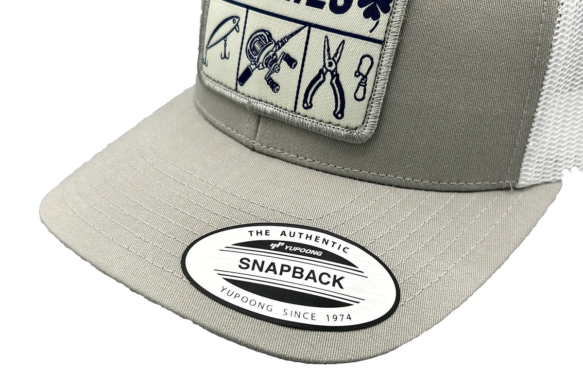 Charlie's Fishing Cap Essential Grey, close-up of the curved visor and patch of the light grey snapback fishing cap