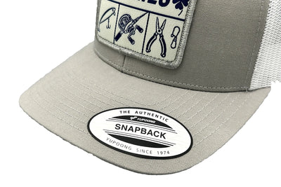 Charlie's Fishing Cap Essential Grey, close-up of the curved visor and patch of the light grey snapback fishing cap