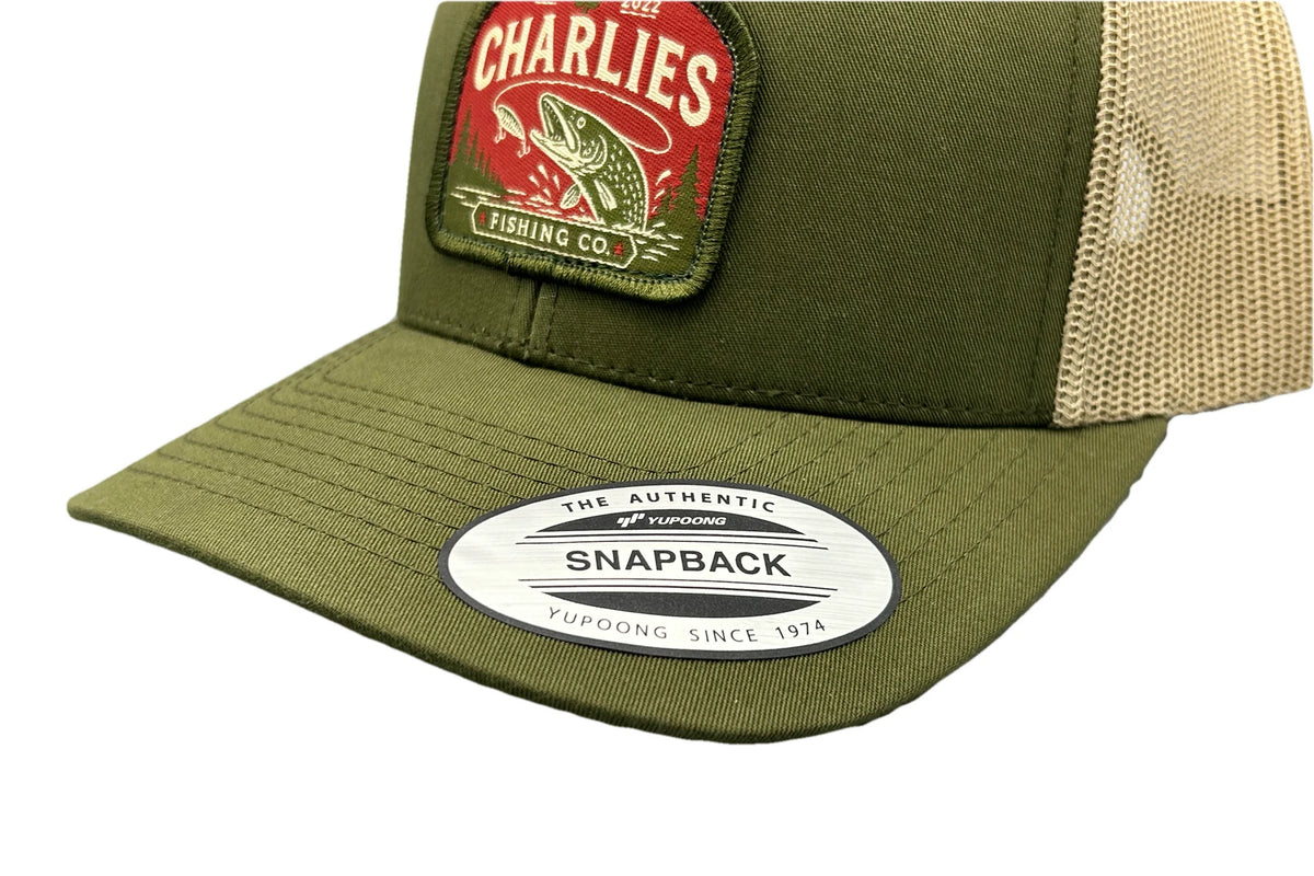 Charlie's Fishing Cap Green Pike, close-up of the curved visor and pike patch of the olive green snapback fishing cap